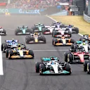 BUDAPEST, HUNGARY - JULY 31: George Russell of Great Britain driving the (63) Mercedes AMG Petronas F1 Team W13 and Carlos Sainz of Spain driving (55) the Ferrari F1-75 battle for track position ahead of the field into turn one at the start during the F1 Grand Prix of Hungary at Hungaroring on July 31, 2022 in Budapest, Hungary. (Photo by Mark Thompson/Getty Images)