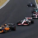 BUDAPEST, HUNGARY - JULY 31: Daniel Ricciardo of Australia driving the (3) McLaren MCL36 Mercedes leads Mick Schumacher of Germany driving the (47) Haas F1 VF-22 Ferrari during the F1 Grand Prix of Hungary at Hungaroring on July 31, 2022 in Budapest, Hungary. (Photo by Bryn Lennon - Formula 1/Formula 1 via Getty Images)