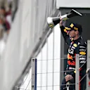 BUDAPEST, HUNGARY - JULY 31: Race winner Max Verstappen of the Netherlands and Oracle Red Bull Racing celebrates on the podium during the F1 Grand Prix of Hungary at Hungaroring on July 31, 2022 in Budapest, Hungary. (Photo by Rudy Carezzevoli - Formula 1/Formula 1 via Getty Images)