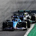 MONZA, ITALY - SEPTEMBER 11: Fernando Alonso of Spain driving the (14) Alpine F1 A522 Renault leads Lewis Hamilton of Great Britain driving the (44) Mercedes AMG Petronas F1 Team W13 during the F1 Grand Prix of Italy at Autodromo Nazionale Monza on September 11, 2022 in Monza, Italy. (Photo by Joe Portlock - Formula 1/Formula 1 via Getty Images)