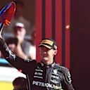 MONZA, ITALY - SEPTEMBER 11: Third placed George Russell of Great Britain and Mercedes celebrates on the podium during the F1 Grand Prix of Italy at Autodromo Nazionale Monza on September 11, 2022 in Monza, Italy. (Photo by Joe Portlock - Formula 1/Formula 1 via Getty Images)