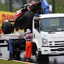 SUZUKA, JAPAN - OCTOBER 07: The car of Mick Schumacher of Germany and Haas F1 is collected from the track after a crash during practice ahead of the F1 Grand Prix of Japan at Suzuka International Racing Course on October 07, 2022 in Suzuka, Japan. (Photo by Dan Istitene - Formula 1/Formula 1 via Getty Images)