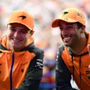 SUZUKA, JAPAN - OCTOBER 08: Daniel Ricciardo of Australia and McLaren and Lando Norris of Great Britain and McLaren pose for a photo on the fan stage prior to final practice ahead of the F1 Grand Prix of Japan at Suzuka International Racing Course on October 08, 2022 in Suzuka, Japan. (Photo by Mario Renzi - Formula 1/Formula 1 via Getty Images)