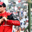 SUZUKA, JAPAN - OCTOBER 08: Second placed qualifier Charles Leclerc of Monaco and Ferrari looks on in parc ferme during qualifying ahead of the F1 Grand Prix of Japan at Suzuka International Racing Course on October 08, 2022 in Suzuka, Japan. (Photo by Mark Thompson/Getty Images )