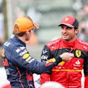 SUZUKA, JAPAN - OCTOBER 08: Max Verstappen of Red Bull Racing and The Netherlands hats with Carlos Sainz of Ferrari and Spain  during qualifying ahead of the F1 Grand Prix of Japan at Suzuka International Racing Course on October 08, 2022 in Suzuka, Japan. (Photo by Peter Fox/Getty Images )
