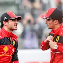 SUZUKA, JAPAN - OCTOBER 08: Carlos Sainz of Ferrari and Spain chats with Charles Leclerc of Ferrari and Monaco during qualifying ahead of the F1 Grand Prix of Japan at Suzuka International Racing Course on October 08, 2022 in Suzuka, Japan. (Photo by Peter Fox/Getty Images )