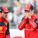 SUZUKA, JAPAN - OCTOBER 08: Carlos Sainz of Ferrari and Spain chats with Charles Leclerc of Ferrari and Monaco during qualifying ahead of the F1 Grand Prix of Japan at Suzuka International Racing Course on October 08, 2022 in Suzuka, Japan. (Photo by Peter Fox/Getty Images )