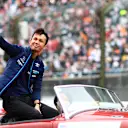 SUZUKA, JAPAN - OCTOBER 09: Alexander Albon of Thailand and Williams waves to the crowd on the drivers parade prior to the F1 Grand Prix of Japan at Suzuka International Racing Course on October 09, 2022 in Suzuka, Japan. (Photo by Dan Istitene - Formula 1/Formula 1 via Getty Images)