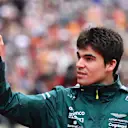 SUZUKA, JAPAN - OCTOBER 09: Lance Stroll of Canada and Aston Martin F1 Team waves to the crowd during the drivers parade ahead of the F1 Grand Prix of Japan at Suzuka International Racing Course on October 09, 2022 in Suzuka, Japan. (Photo by Clive Mason/Getty Images)