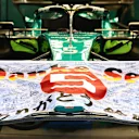 SUZUKA, JAPAN - OCTOBER 09: The car of Sebastian Vettel of Germany and Aston Martin F1 Team is pictured in the garage with a Japan flag thanking him for his F1 career prior to the F1 Grand Prix of Japan at Suzuka International Racing Course on October 09, 2022 in Suzuka, Japan. (Photo by Clive Rose/Getty Images)