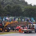 SUZUKA, JAPAN - OCTOBER 09: The car of Carlos Sainz of Spain and Ferrari is recovered from the track after a crash during the F1 Grand Prix of Japan at Suzuka International Racing Course on October 09, 2022 in Suzuka, Japan. (Photo by Bryn Lennon - Formula 1/Formula 1 via Getty Images)