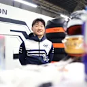 SUZUKA, JAPAN - OCTOBER 09: Yuki Tsunoda of Japan and Scuderia AlphaTauri looks on in the garage during a red flag delay during the F1 Grand Prix of Japan at Suzuka International Racing Course on October 09, 2022 in Suzuka, Japan. (Photo by Peter Fox/Getty Images)