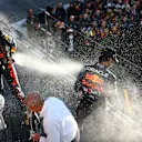 SUZUKA, JAPAN - OCTOBER 09: Race winner and 2022 F1 World Drivers Champion Max Verstappen of Netherlands and Oracle Red Bull Racing and Second placed Sergio Perez of Mexico and Oracle Red Bull Racing celebrate on the podium during the F1 Grand Prix of Japan at Suzuka International Racing Course on October 09, 2022 in Suzuka, Japan. (Photo by Mark Thompson/Getty Images )