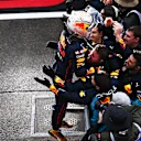 SUZUKA, JAPAN - OCTOBER 09: Race winner and 2022 F1 World Drivers Champion Max Verstappen of Netherlands and Oracle Red Bull Racing celebrates with his team in parc ferme during the F1 Grand Prix of Japan at Suzuka International Racing Course on October 09, 2022 in Suzuka, Japan. (Photo by Clive Mason/Getty Images)