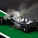 MEXICO CITY, MEXICO - OCTOBER 28: Liam Lawson of New Zealand and Scuderia AlphaTauri climbs from his car after stopping on track during practice ahead of the F1 Grand Prix of Mexico at Autodromo Hermanos Rodriguez on October 28, 2022 in Mexico City, Mexico. (Photo by Chris Graythen/Getty Images)