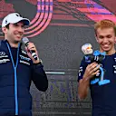 MEXICO CITY, MEXICO - OCTOBER 29: Nicholas Latifi of Canada and Williams and Alexander Albon of Thailand and Williams are presented with figurines made in their likeness on the fan stage prior to final practice ahead of the F1 Grand Prix of Mexico at Autodromo Hermanos Rodriguez on October 29, 2022 in Mexico City, Mexico. (Photo by Clive Mason - Formula 1/Formula 1 via Getty Images)