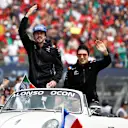 MEXICO CITY, MEXICO - OCTOBER 30: Fernando Alonso of Spain and Alpine F1 and Esteban Ocon of France and Alpine F1 wave to the crowd on the drivers parade prior to the F1 Grand Prix of Mexico at Autodromo Hermanos Rodriguez on October 30, 2022 in Mexico City, Mexico. (Photo by Jared C. Tilton/Getty Images)