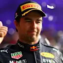 MEXICO CITY, MEXICO - OCTOBER 30: Third placed Sergio Perez of Mexico and Oracle Red Bull Racing celebrates on the podium after the F1 Grand Prix of Mexico at Autodromo Hermanos Rodriguez on October 30, 2022 in Mexico City, Mexico. (Photo by Dan Istitene - Formula 1/Formula 1 via Getty Images)