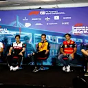 MIAMI, FLORIDA - MAY 06: (L-R) George Russell of Great Britain and Mercedes, Zhou Guanyu of China and Alfa Romeo F1, Lando Norris of Great Britain and McLaren, Carlos Sainz of Spain and Ferrari and Sebastian Vettel of Germany and Aston Martin F1 Team attend the Drivers Press Conference prior to practice ahead of the F1 Grand Prix of Miami at the Miami International Autodrome on May 06, 2022 in Miami, Florida. (Photo by Jared C. Tilton/Getty Images)