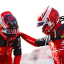 MIAMI, FLORIDA - MAY 07: Pole position qualifier Charles Leclerc of Monaco and Ferrari and Second placed qualifier Carlos Sainz of Spain and Ferrari celebrate in parc ferme during qualifying ahead of the F1 Grand Prix of Miami at the Miami International Autodrome on May 07, 2022 in Miami, Florida. (Photo by Dan Istitene - Formula 1/Formula 1 via Getty Images)