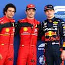 MIAMI, FLORIDA - MAY 07: Pole position qualifier Charles Leclerc of Monaco and Ferrari (C), Second placed qualifier Carlos Sainz of Spain and Ferrari (L) and Third placed qualifier Max Verstappen of the Netherlands and Oracle Red Bull Racing (R) pose for a photo in parc ferme during qualifying ahead of the F1 Grand Prix of Miami at the Miami International Autodrome on May 07, 2022 in Miami, Florida. (Photo by Dan Istitene - Formula 1/Formula 1 via Getty Images)