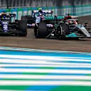 MIAMI, FLORIDA - MAY 08: George Russell of Great Britain driving the (63) Mercedes AMG Petronas F1 Team W13 leads Alexander Albon of Thailand driving the (23) Williams FW44 Mercedes during the F1 Grand Prix of Miami at the Miami International Autodrome on May 08, 2022 in Miami, Florida. (Photo by Chris Graythen/Getty Images)
