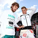 MIAMI, FLORIDA - MAY 08: Sebastian Vettel of Germany and Aston Martin F1 Team and Mick Schumacher of Germany and Haas F1 talk on the grid during the F1 Grand Prix of Miami at the Miami International Autodrome on May 08, 2022 in Miami, Florida. (Photo by Dan Istitene - Formula 1/Formula 1 via Getty Images)