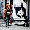 MIAMI, FLORIDA - MAY 08: Lando Norris of Great Britain and McLaren walks in the Pitlane after crashing out of the race during the F1 Grand Prix of Miami at the Miami International Autodrome on May 08, 2022 in Miami, Florida. (Photo by Jared C. Tilton/Getty Images)