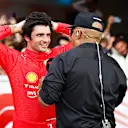 MIAMI, FLORIDA - MAY 08: Third placed Carlos Sainz of Spain and Ferrari talks with Willy T Ribbs in parc ferme during the F1 Grand Prix of Miami at the Miami International Autodrome on May 08, 2022 in Miami, Florida. (Photo by Jared C. Tilton/Getty Images)