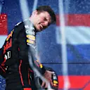 MIAMI, FLORIDA - MAY 08: Race winner Max Verstappen of the Netherlands and Oracle Red Bull Racing celebrates on the podium during the F1 Grand Prix of Miami at the Miami International Autodrome on May 08, 2022 in Miami, Florida. (Photo by Mark Thompson/Getty Images)