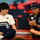 MONTE-CARLO, MONACO - MAY 27: Yuki Tsunoda of Japan and Scuderia AlphaTauri and Sergio Perez of Mexico and Oracle Red Bull Racing talk in the Drivers Press Conference prior to practice ahead of the F1 Grand Prix of Monaco at Circuit de Monaco on May 27, 2022 in Monte-Carlo, Monaco. (Photo by Clive Mason/Getty Images)