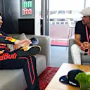 MONTE-CARLO, MONACO - MAY 28: Max Verstappen of the Netherlands and Oracle Red Bull Racing talks with Patrick Dempsey prior to qualifying ahead of the F1 Grand Prix of Monaco at Circuit de Monaco on May 28, 2022 in Monte-Carlo, Monaco. (Photo by Mark Thompson/Getty Images)