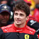 MONTE-CARLO, MONACO - MAY 28: Pole position qualifier Charles Leclerc of Monaco and Ferrari smiles in parc ferme during qualifying ahead of the F1 Grand Prix of Monaco at Circuit de Monaco on May 28, 2022 in Monte-Carlo, Monaco. (Photo by Clive Rose/Getty Images)