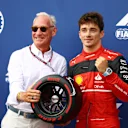 MONTE-CARLO, MONACO - MAY 28: Pole position qualifier Charles Leclerc of Monaco and Ferrari is presented with the Pirelli Pole Position trophy by Liberty CEO Greg Maffei during qualifying ahead of the F1 Grand Prix of Monaco at Circuit de Monaco on May 28, 2022 in Monte-Carlo, Monaco. (Photo by Mark Thompson/Getty Images)
