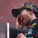 MONTE-CARLO, MONACO - MAY 29: Race winner Sergio Perez of Mexico and Oracle Red Bull Racing celebrates on the podium during the F1 Grand Prix of Monaco at Circuit de Monaco on May 29, 2022 in Monte-Carlo, Monaco. (Photo by Mark Thompson/Getty Images)