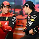 MONTE-CARLO, MONACO - MAY 29: Race winner Sergio Perez of Mexico and Oracle Red Bull Racing and Second placed Carlos Sainz of Spain and Ferrari talk in the press conference after the F1 Grand Prix of Monaco at Circuit de Monaco on May 29, 2022 in Monte-Carlo, Monaco. (Photo by Clive Mason/Getty Images)