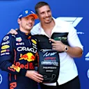 ZANDVOORT, NETHERLANDS - SEPTEMBER 03: Pole position qualifier Max Verstappen of the Netherlands and Oracle Red Bull Racing is presented with the Pirelli Pole Position Award by Rico Verhoeven in parc ferme during qualifying ahead of the F1 Grand Prix of The Netherlands at Circuit Zandvoort on September 03, 2022 in Zandvoort, Netherlands. (Photo by Mark Thompson/Getty Images)