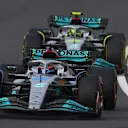 ZANDVOORT, NETHERLANDS - SEPTEMBER 04: George Russell of Great Britain driving the (63) Mercedes AMG Petronas F1 Team W13 leads Lewis Hamilton of Great Britain driving the (44) Mercedes AMG Petronas F1 Team W13 during the F1 Grand Prix of The Netherlands at Circuit Zandvoort on September 04, 2022 in Zandvoort, Netherlands. (Photo by Clive Mason/Getty Images)