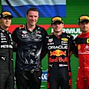 ZANDVOORT, NETHERLANDS - SEPTEMBER 04: Race winner Max Verstappen of the Netherlands and Oracle Red Bull Racing, second placed George Russell of Great Britain and Mercedes and third placed Charles Leclerc of Monaco and Ferrari celebrate on the podium during the F1 Grand Prix of The Netherlands at Circuit Zandvoort on September 04, 2022 in Zandvoort, Netherlands. (Photo by Dan Mullan/Getty Images)
