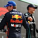 ZANDVOORT, NETHERLANDS - SEPTEMBER 04: Race winner Max Verstappen of the Netherlands and Oracle Red Bull Racing celebrates with second placed George Russell of Great Britain and Mercedes in parc ferme during the F1 Grand Prix of The Netherlands at Circuit Zandvoort on September 04, 2022 in Zandvoort, Netherlands. (Photo by Mark Thompson/Getty Images)