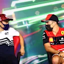 JEDDAH, SAUDI ARABIA - MARCH 25: Yuki Tsunoda of Japan and Scuderia AlphaTauri and Charles Leclerc of Monaco and Ferrari talk in the Drivers Press Conference before practice ahead of the F1 Grand Prix of Saudi Arabia at the Jeddah Corniche Circuit on March 25, 2022 in Jeddah, Saudi Arabia. (Photo by Dan Istitene - Formula 1/Formula 1 via Getty Images)