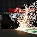 JEDDAH, SAUDI ARABIA - MARCH 25: Sparks fly behind George Russell of Great Britain driving the (63) Mercedes AMG Petronas F1 Team W13 on track during practice ahead of the F1 Grand Prix of Saudi Arabia at the Jeddah Corniche Circuit on March 25, 2022 in Jeddah, Saudi Arabia. (Photo by Clive Mason/Getty Images)