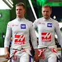 JEDDAH, SAUDI ARABIA - MARCH 25:  Mick Schumacher of Germany and Haas F1 and Kevin Magnussen of Denmark and Haas F1 walk in the paddock after practice ahead of the F1 Grand Prix of Saudi Arabia at the Jeddah Corniche Circuit on March 25, 2022 in Jeddah, Saudi Arabia. (Photo by Dan Istitene - Formula 1/Formula 1 via Getty Images)