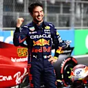 JEDDAH, SAUDI ARABIA - MARCH 26: Pole position qualifier Sergio Perez of Mexico and Oracle Red Bull Racing celebrates in parc ferme during qualifying ahead of the F1 Grand Prix of Saudi Arabia at the Jeddah Corniche Circuit on March 26, 2022 in Jeddah, Saudi Arabia. (Photo by Mark Thompson/Getty Images)