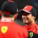 JEDDAH, SAUDI ARABIA - MARCH 26: Third placed qualifier Carlos Sainz of Spain and Ferrari talks with Second placed qualifier Charles Leclerc of Monaco and Ferrari in parc ferme during qualifying ahead of the F1 Grand Prix of Saudi Arabia at the Jeddah Corniche Circuit on March 26, 2022 in Jeddah, Saudi Arabia. (Photo by Dan Istitene - Formula 1/Formula 1 via Getty Images)