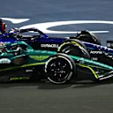 JEDDAH, SAUDI ARABIA - MARCH 27: Nico Hulkenberg of Germany driving the (27) Aston Martin AMR22 Mercedes and Alexander Albon of Thailand driving the (23) Williams FW44 Mercedes battle for track position during the F1 Grand Prix of Saudi Arabia at the Jeddah Corniche Circuit on March 27, 2022 in Jeddah, Saudi Arabia. (Photo by Lars Baron/Getty Images)