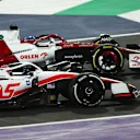 JEDDAH, SAUDI ARABIA - MARCH 27: Valtteri Bottas of Finland driving the (77) Alfa Romeo F1 C42 Ferrari and Kevin Magnussen of Denmark driving the (20) Haas F1 VF-22 Ferrari battle for track position during the F1 Grand Prix of Saudi Arabia at the Jeddah Corniche Circuit on March 27, 2022 in Jeddah, Saudi Arabia. (Photo by Lars Baron/Getty Images)