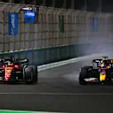 JEDDAH, SAUDI ARABIA - MARCH 27: Max Verstappen of the Netherlands driving the (1) Oracle Red Bull Racing RB18 and Charles Leclerc of Monaco driving (16) the Ferrari F1-75 battle for track position during the F1 Grand Prix of Saudi Arabia at the Jeddah Corniche Circuit on March 27, 2022 in Jeddah, Saudi Arabia. (Photo by Joe Portlock - Formula 1/Formula 1 via Getty Images)