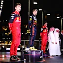 JEDDAH, SAUDI ARABIA - MARCH 27: Race winner Max Verstappen of the Netherlands and Oracle Red Bull Racing, Second placed Charles Leclerc of Monaco and Ferrari and Third placed Carlos Sainz of Spain and Ferrari stand on the podium during the F1 Grand Prix of Saudi Arabia at the Jeddah Corniche Circuit on March 27, 2022 in Jeddah, Saudi Arabia. (Photo by Dan Istitene - Formula 1/Formula 1 via Getty Images)