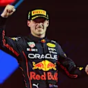 JEDDAH, SAUDI ARABIA - MARCH 27: Race winner Max Verstappen of the Netherlands and Oracle Red Bull Racing celebrates on the podium during the F1 Grand Prix of Saudi Arabia at the Jeddah Corniche Circuit on March 27, 2022 in Jeddah, Saudi Arabia. (Photo by Lars Baron/Getty Images)